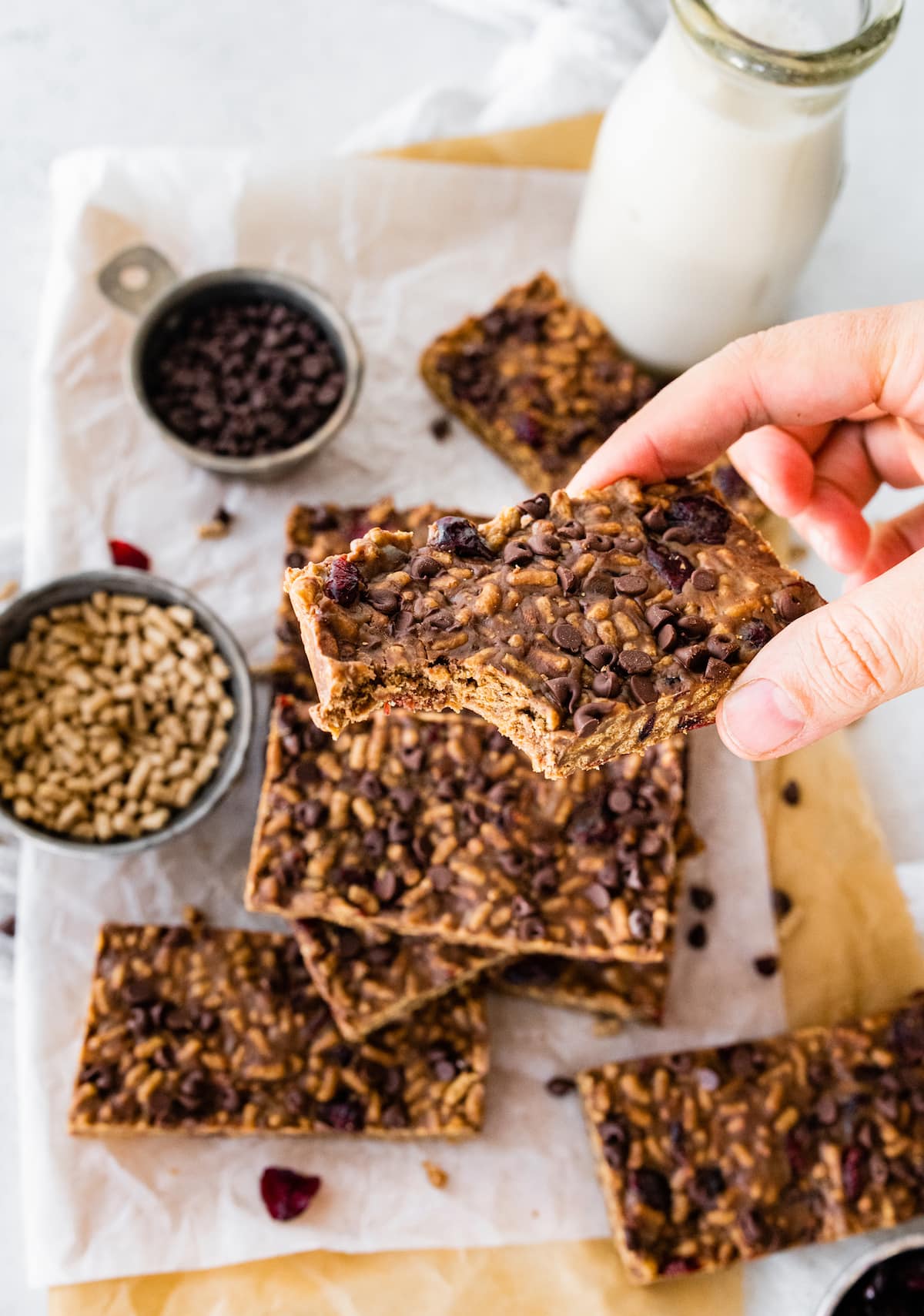 A hand holding up a no bake high fiber bar.