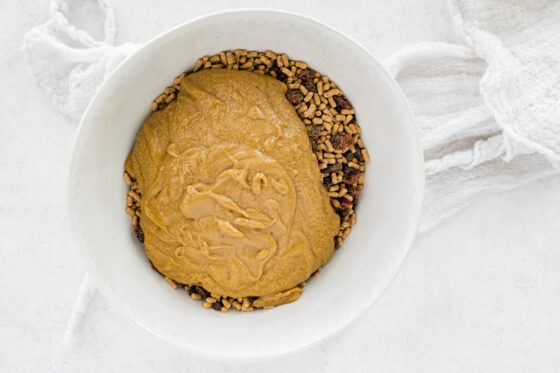 Sunbutter mixture poured into the bowl of dry ingredients.