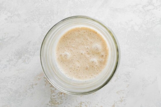 Almond milk and protein powder mixed together in a jar.
