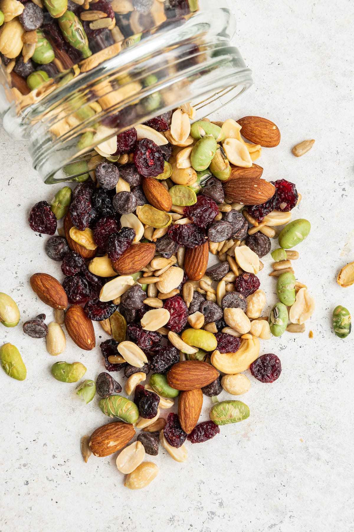 Protein trail mix spilling out of a jar.