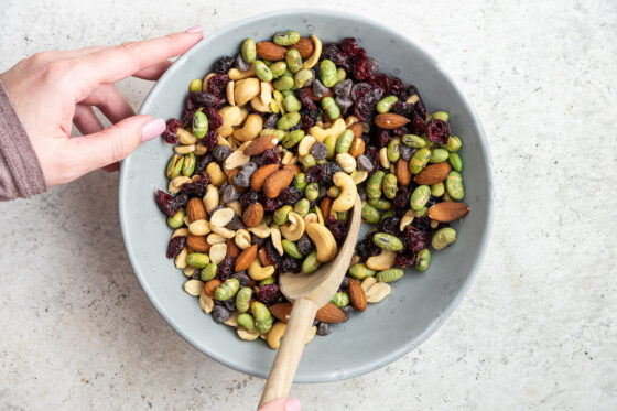 Mixing together ingredients for protein trail mix.