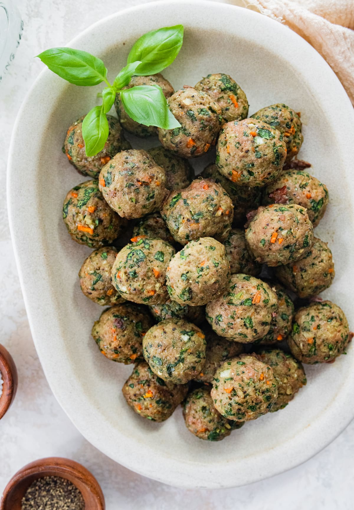 Spinach turkey meatballs on a serving platter.