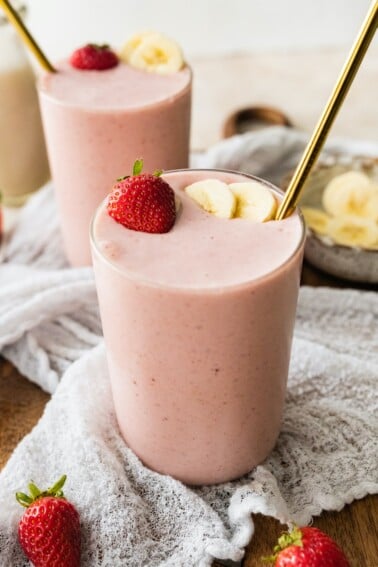A strawberry banana protein smoothie in a glass.