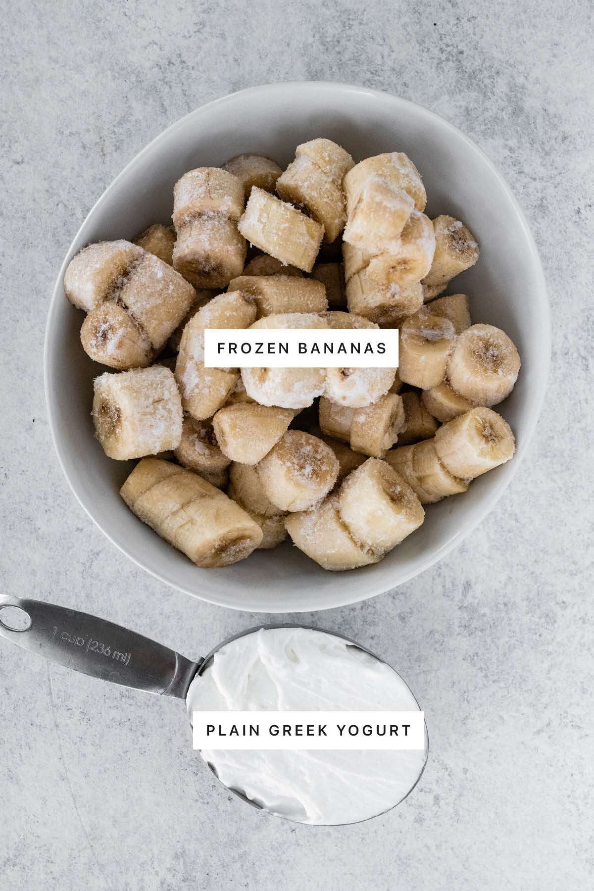 Ingredients measured out to make 2-Ingredient Banana Frozen Yogurt: frozen bananas and plain Greek yogurt.