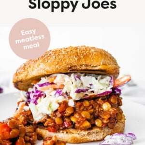 One vegan Sloppy Joe on a whole wheat bun topped with coleslaw.