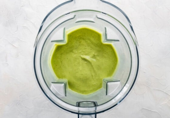 Blended avocado smoothie in blender.