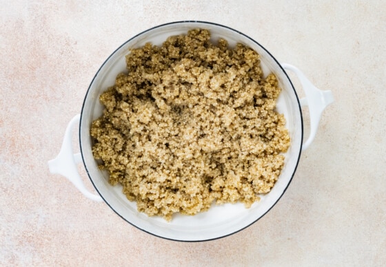 Cooked quinoa in pot for chicken fajita bowls.