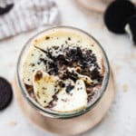 Cookies and cream overnight oats with broken white chocolate magic shell topping.