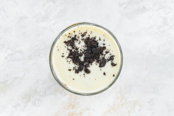 Cookies and cream overnight oats with magic shell topping and crushed oreo cookies.