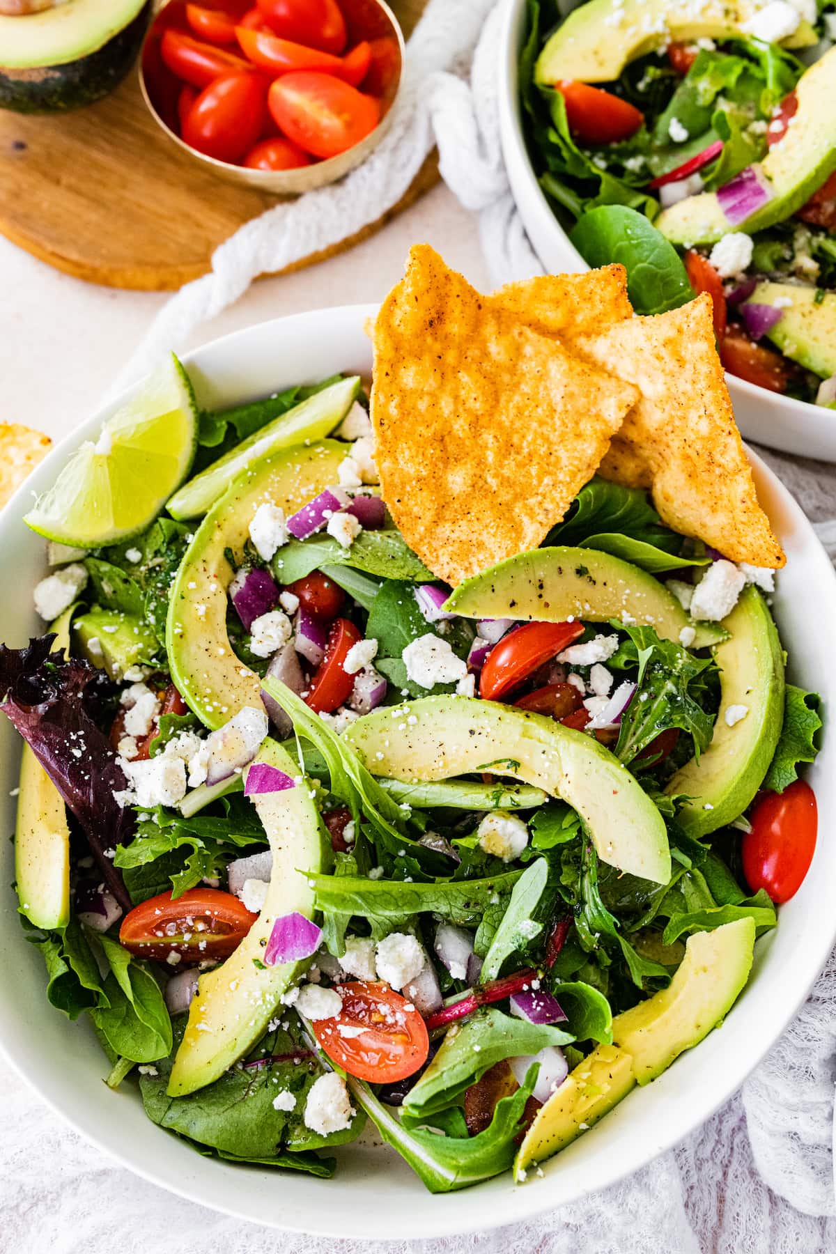 Deconstructed guacamole salad served with chips.