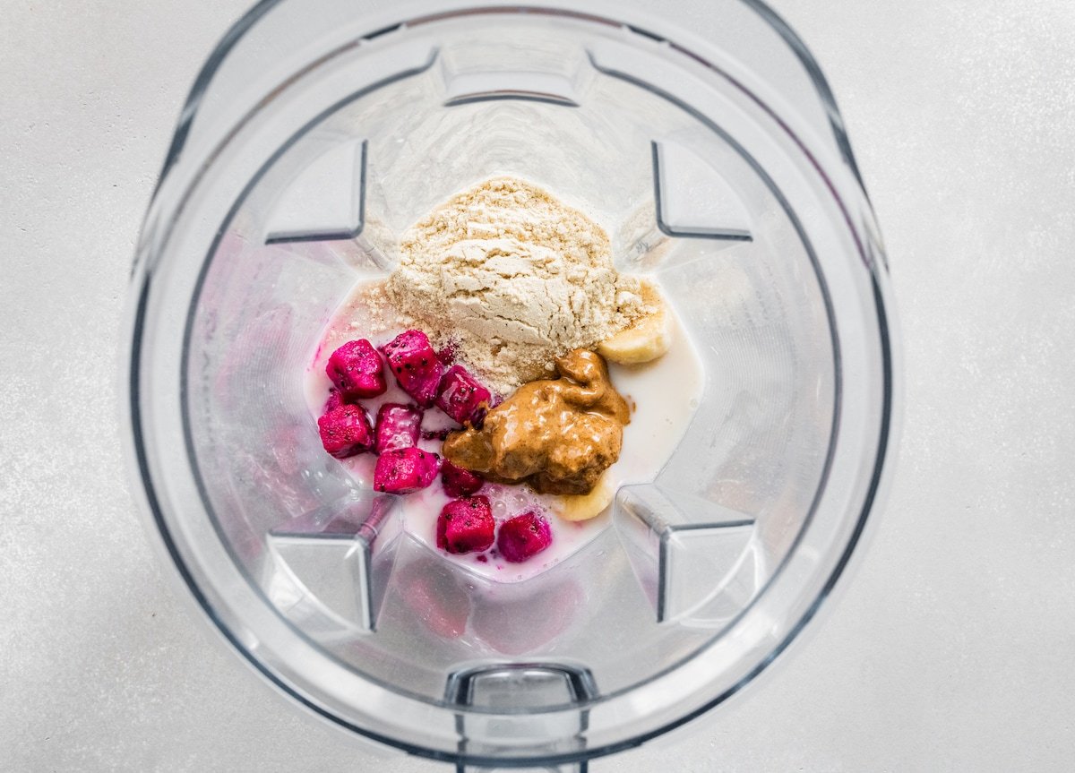 Ingredients for dragon fruit smoothie in blender.