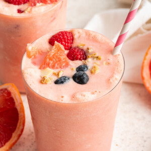 Grapefruit smoothie topped with fresh berries, grapefruit and granola.