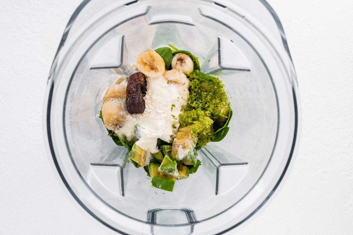 Key lime pie smoothie ingredients in a blender.