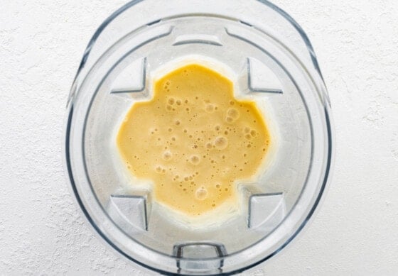 Lemon smoothie blended in a blender.