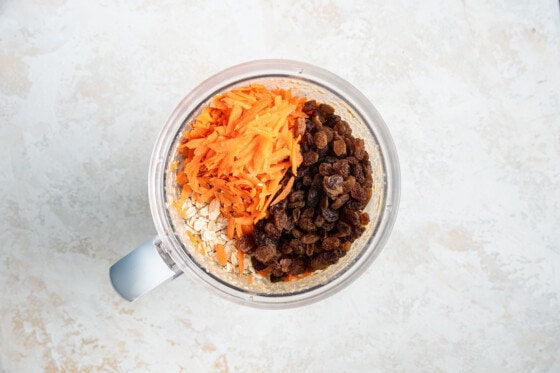 Shredded carrots, raisins and rolled oats added to the blended ingredients for the oatmeal carrot cake.