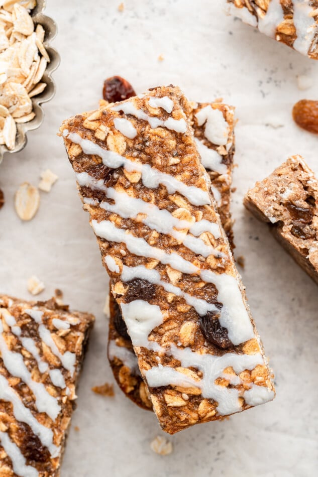 Close up image of one oatmeal raisin protein bar with coconut butter drizzle.