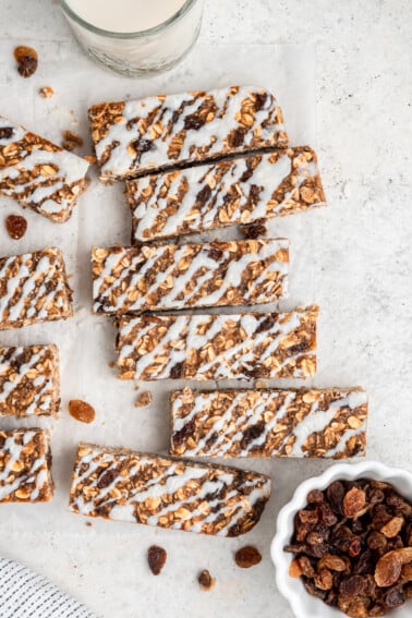Overhead image of oatmeal raisin protein bars with coconut butter drizzle.