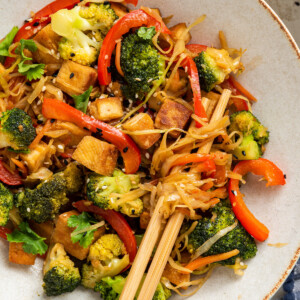 A tofu cabbage noodle bowl in a bowl with chopsticks.