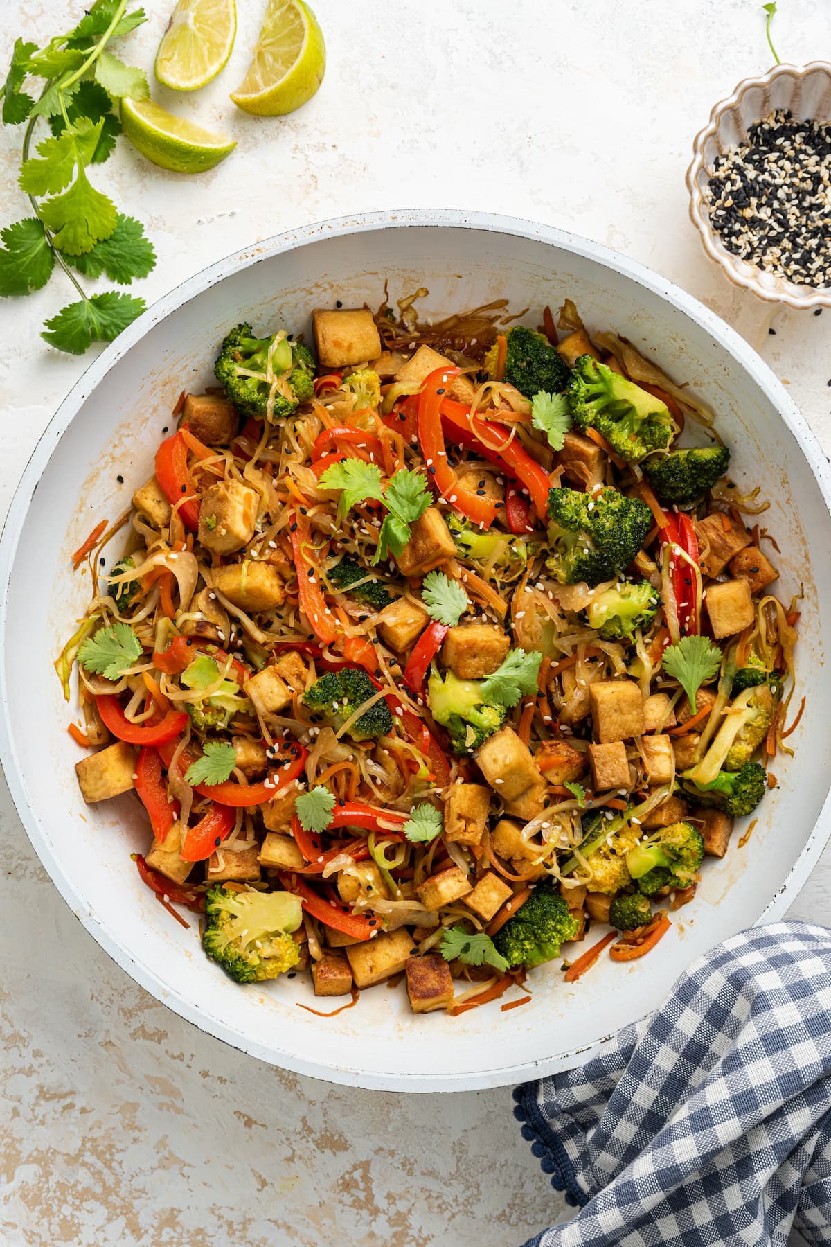 Overhead view of tofu cabbage noodle bowl in a skillet.