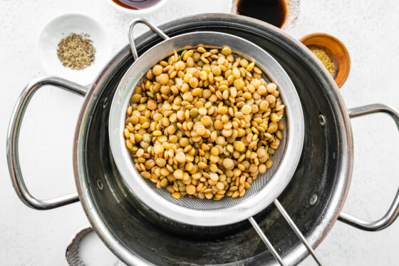 Cooked lentils being drained for the vegan Sloppy Joes.