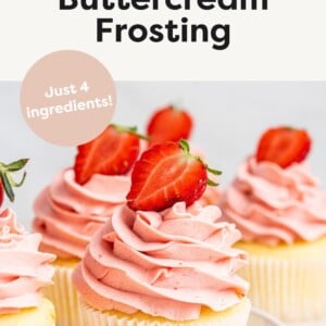 Strawberry Buttercream Frosting piped onto cupcake with sliced strawberry.