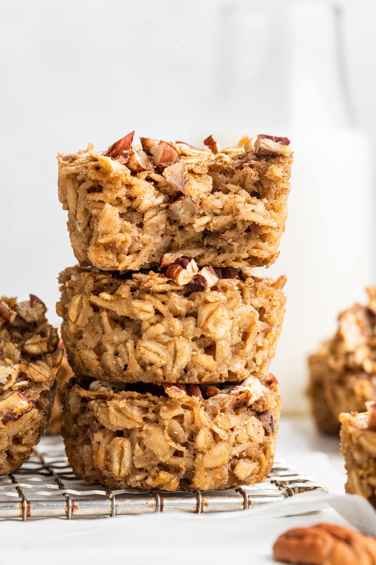 Three chai baked oatmeal cups stacked on one another. The one on top has a bite taken out of it.