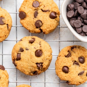 Coconut flour chocolate chip cookies on a wire rack.