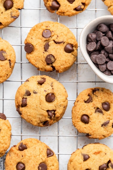 Coconut flour chocolate chip cookies on a wire rack.