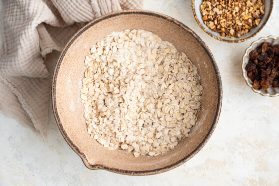 A large bowl with the dry ingredients for the healthy banana oat bars mixed together.