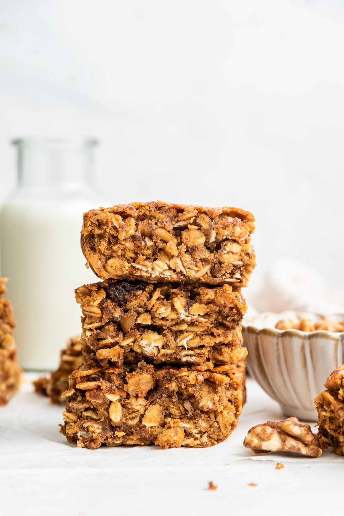 Three healthy banana oat bars stacked on one another.