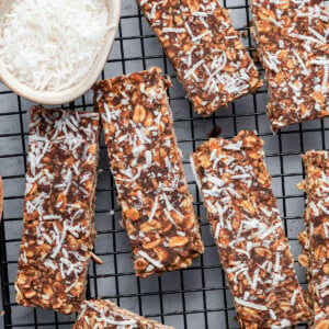 No-bake chocolate coconut bars on a wire rack.