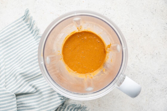 A blender containing the peanut sauce used for the shrimp spring rolls.