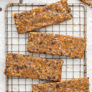 Toasted coconut chia bars on a wire rack.
