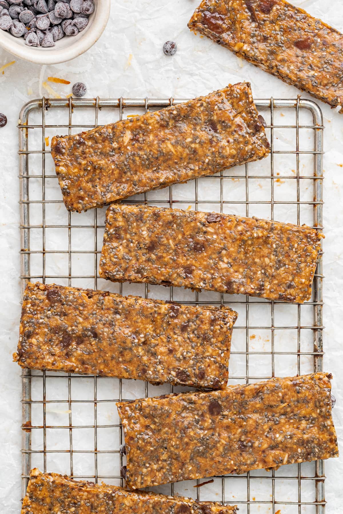 Toasted coconut chia bars on a wire rack.