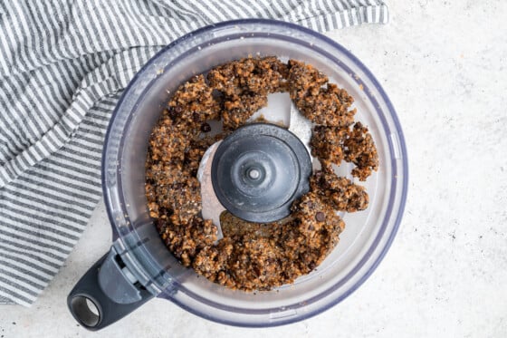 Toasted coconut chia bar mixture in a food processor.