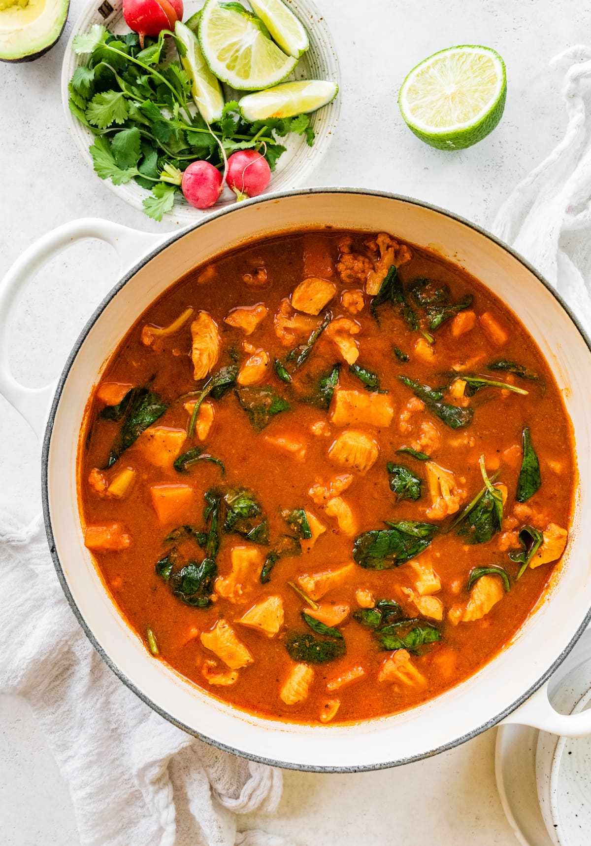 Mexican sweet potato chicken soup in a large white pot.