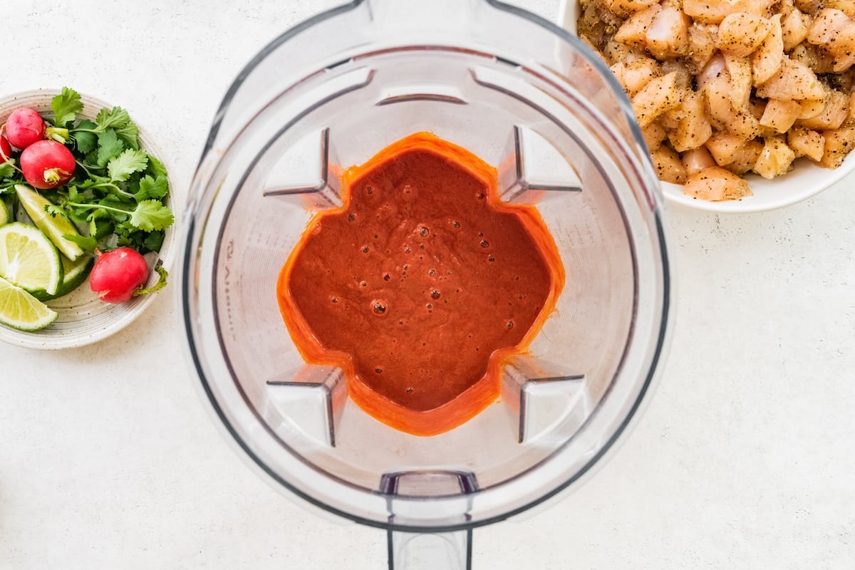 Blended chile peppers with garlic and other spices in a blender.