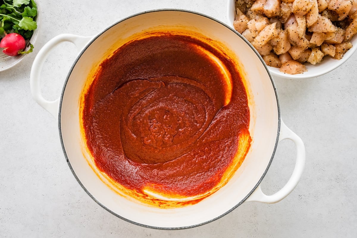 Blended peppers made into a pureé in a large white pot.