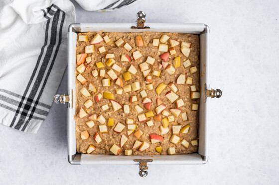 Apple oatmeal bars in a square baking pan after being baked.