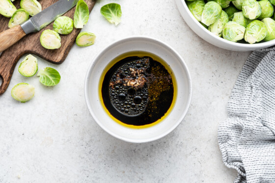 A balsamic vinegar based mixture in a small bowl.