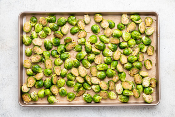 Balsamic Brussels Sprouts on a baking tray before being roasted.
