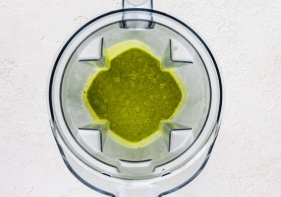 A cilantro lime dressing in a blender.