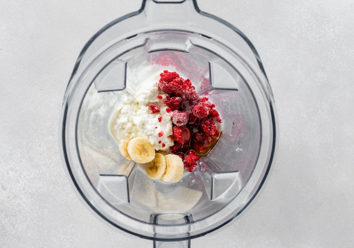 Ingredients for the cottage cheese smoothie in a Vitamix blender.