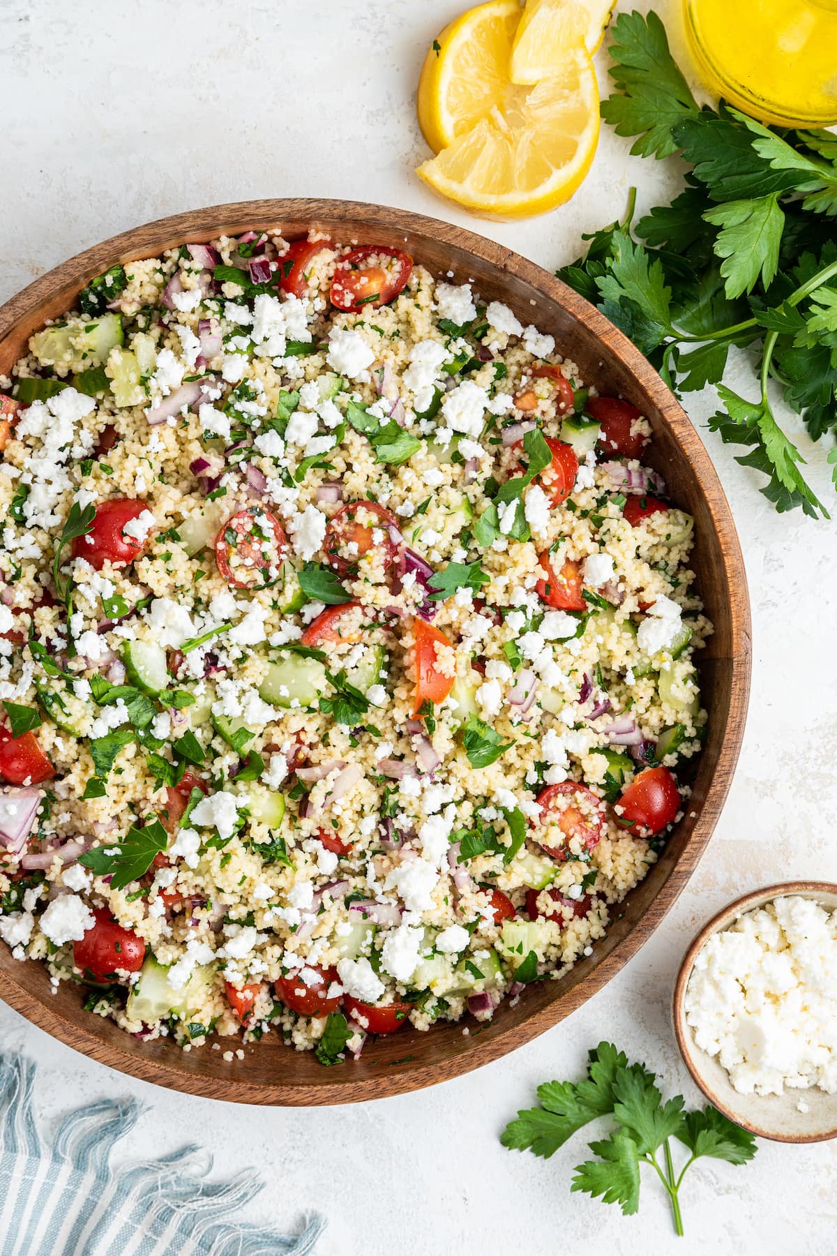 Couscous salad in a large wooden bowl.