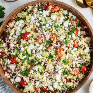 Couscous salad in a large wooden bowl.