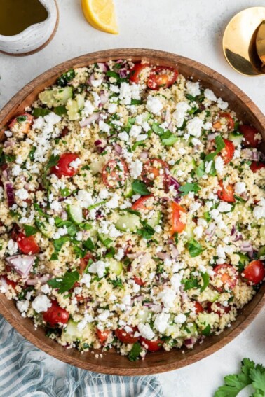 Couscous salad in a large wooden bowl.