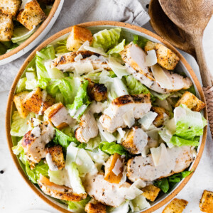 Grilled chicken Caesar salad in a bowl.