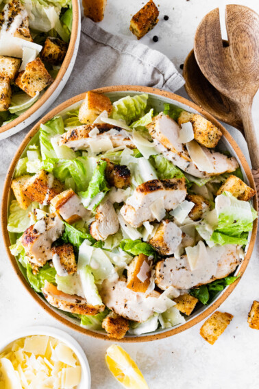 Grilled chicken Caesar salad in a bowl.