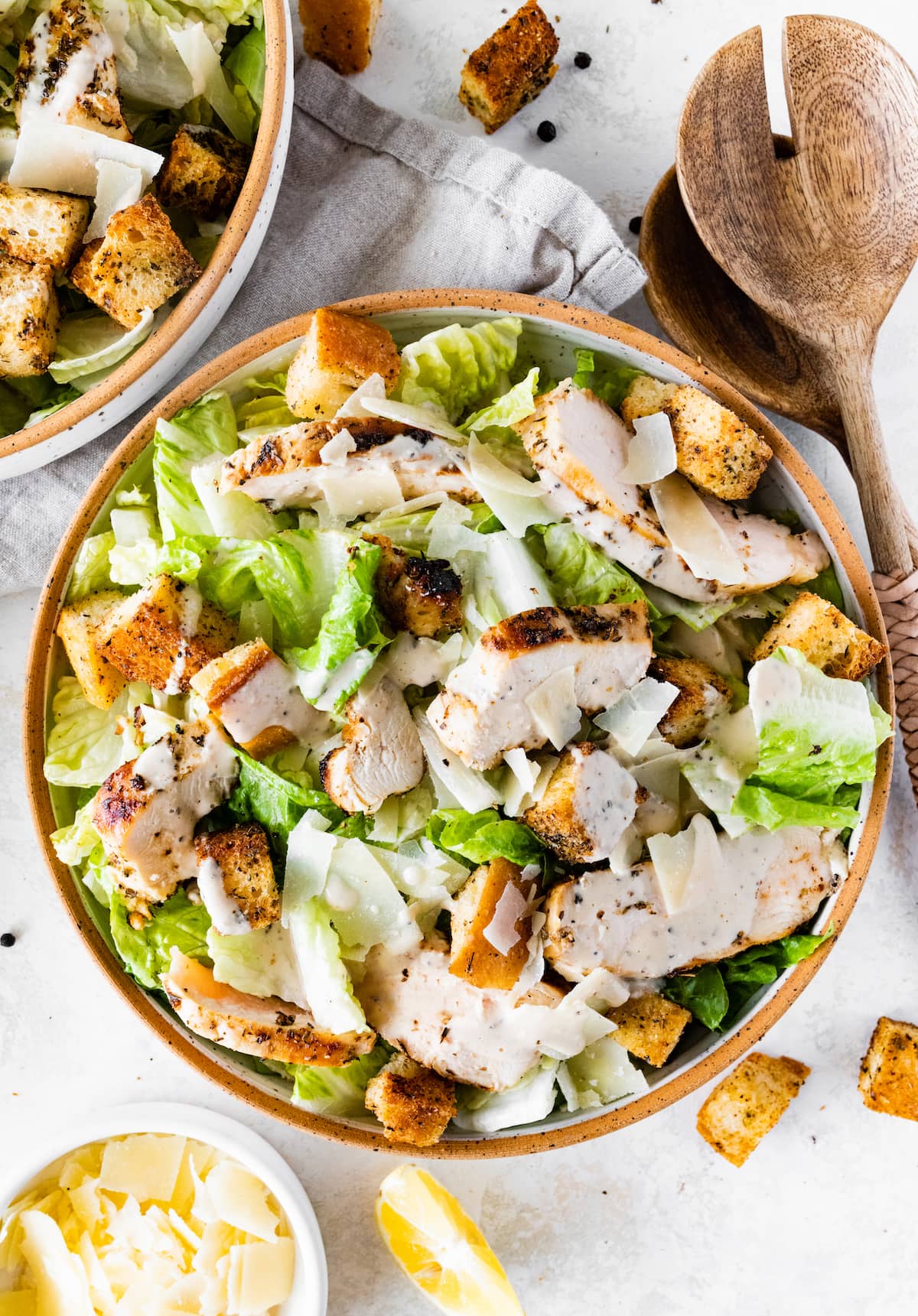 Grilled chicken Caesar salad in a bowl.