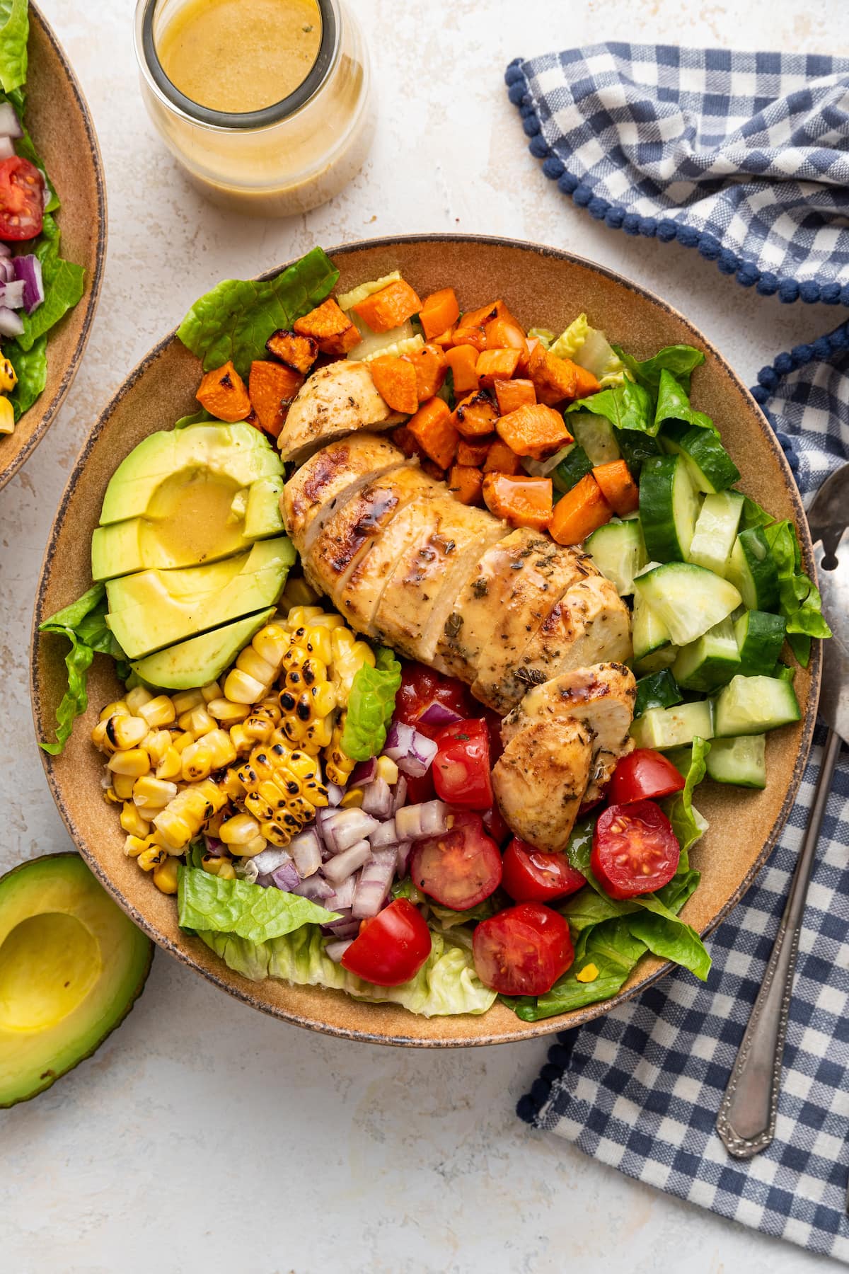 A bowl of grilled chicken salad.